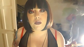 Watch As A Curvy Woman Smokes A Cigarette In A Holder
