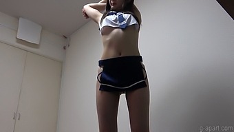 Japanese Schoolgirl In Uniform Practices Indoors